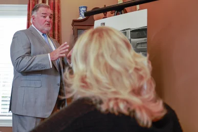 Attorney joel hamner presents a distracted driving accident exhibit to a client, including cell phone record evidence.